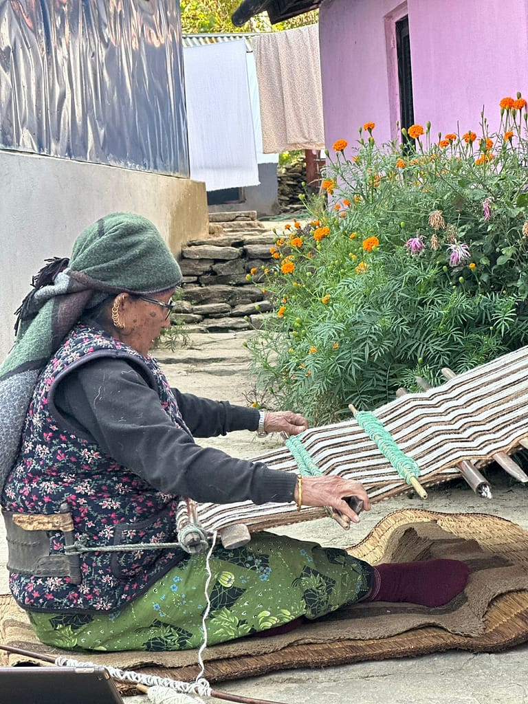 Old Gurung harvesting wild mad honey from Himalayan cliffs in Nepal